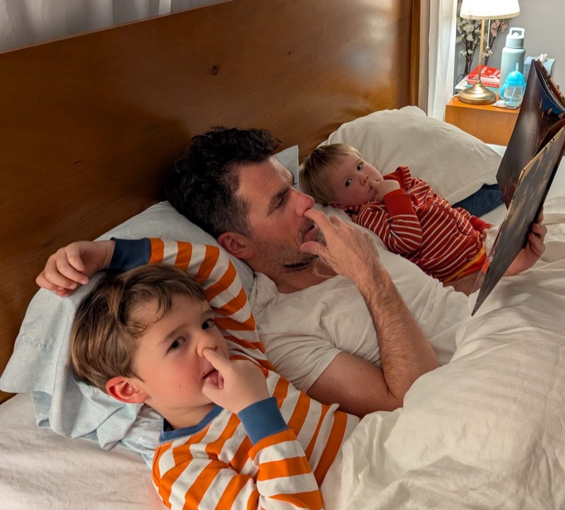 Jim reading a bedtime story with Oliver (7) and Theo (3)